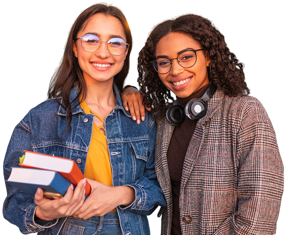 Two smiling female students holding books
