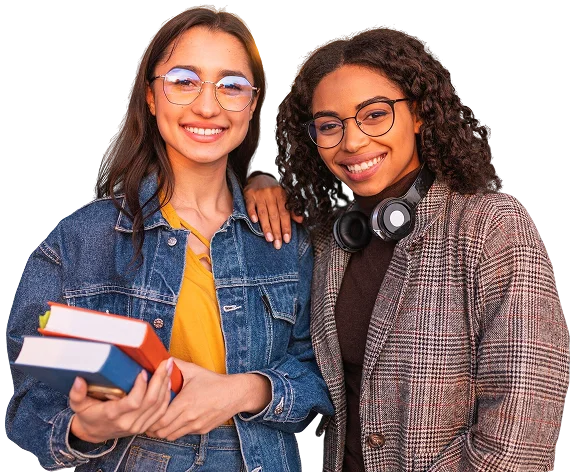 Two smiling female students holding books